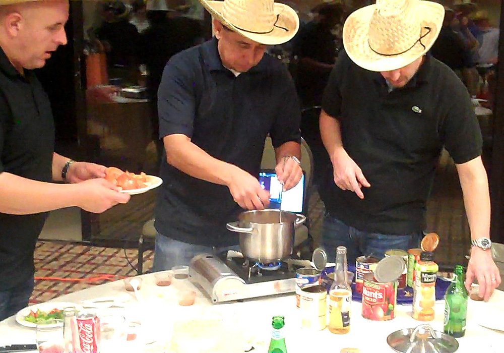 A group of men preparing food.
