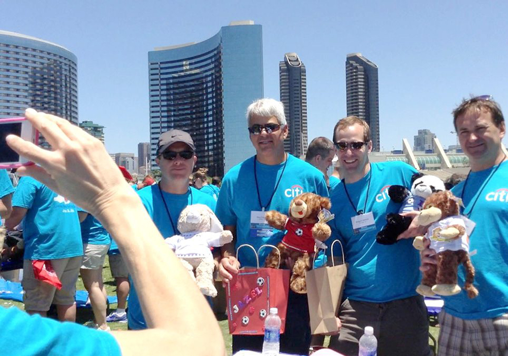 A group of people with teddy bears.