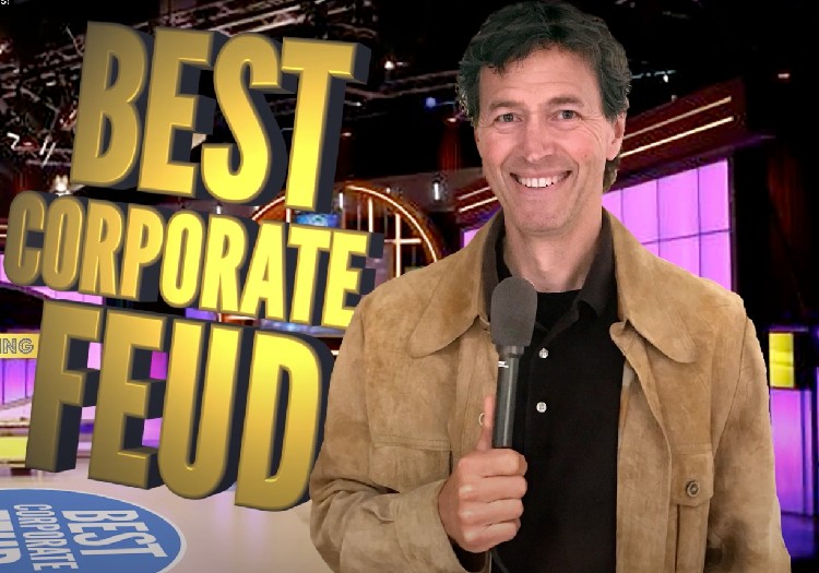 A man in a brown jacket with the words best corporate feud.