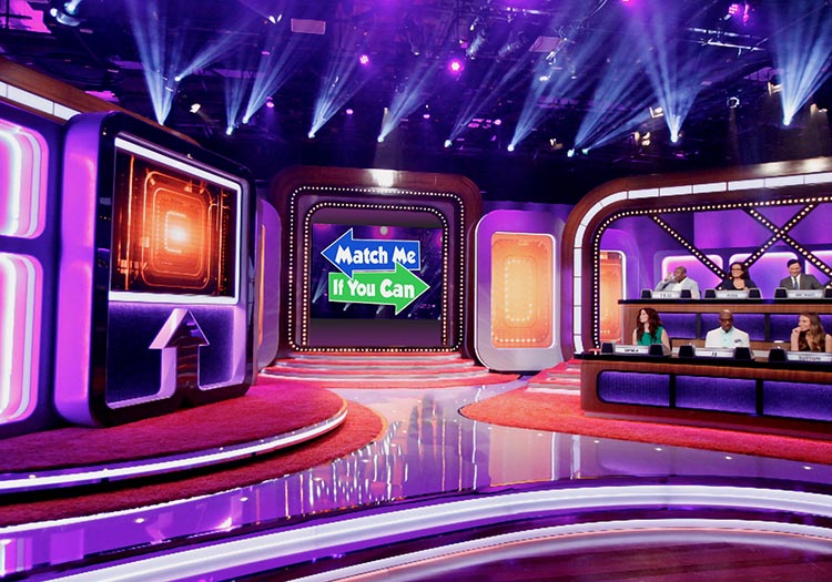 The set of a game show with purple lights.