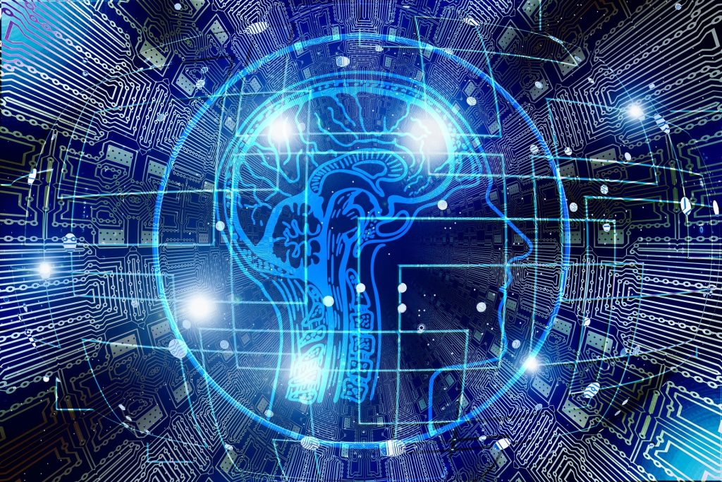 An image of a brain surrounded by electronic circuits, representing the impact of AI in the workplace.